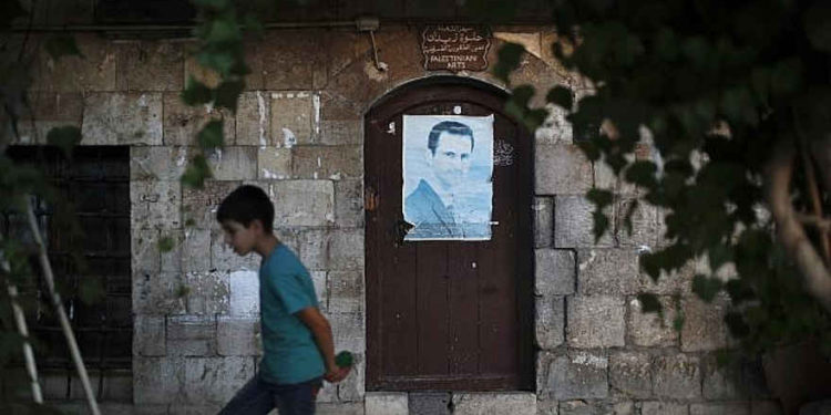 Con la victoria a la vista, carteles de Assad se amontonan en calles de Damasco