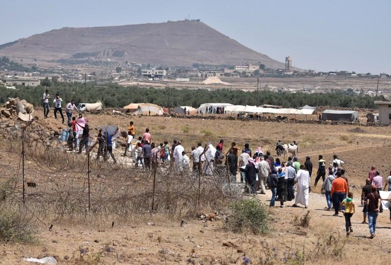 Desplazados sirios cerca de la frontera con Israel el 4 de julio de 2018. (AFP / Mohamad Yusuf)