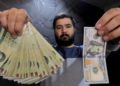 Moneda de Irán registra caída record con respecto al dólar estadounidense