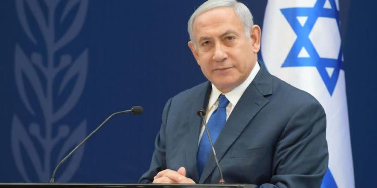 El primer ministro Benjamin Netanyahu en el servicio conmemorativo a Levi Eshkol. (Crédito de la foto: AMOS BEN-GERSHOM / GPO)