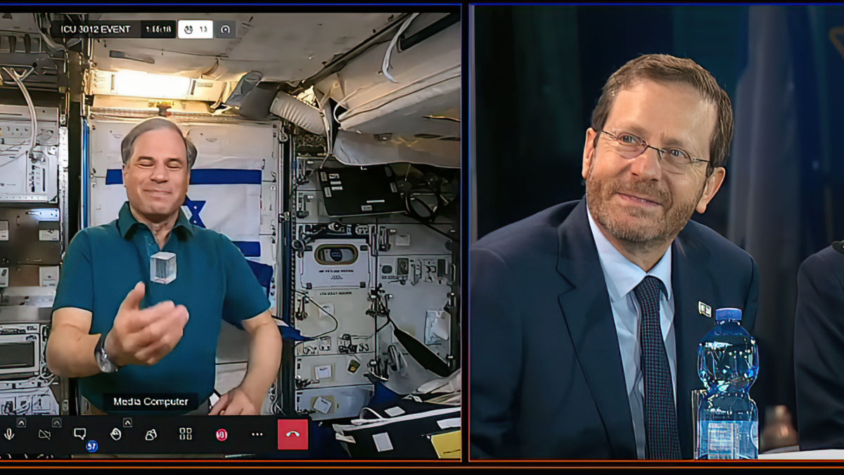 Israeli astronaut Eytan Stibbe, left, speaks with Israeli President Isaac Herzog via video link while on the International Space Station, April 10, 2022. (Screenshot/YouTube)