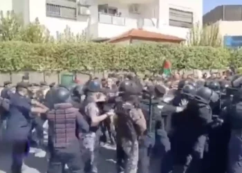 Jordanian security forces disperse the crowd of thousands of protesters trying to storm the Israeli embassy in Amman, Jordan in protest of the war in Gaza on October 18, 2023. (Screen capture/X)