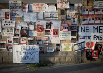 Posters calling for the release of hostages held by Hamas terrorists in Gaza, outside the Defense Ministry in Tel Aviv, October 21, 2023. (Miriam Alster/Flash90)