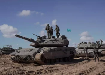 FDI soldiers under the Givati Brigade stand atop a tank in eastern Rafah in the southern Gaza Strip, in a handout picture released on May 10, 2024. (Israel Defense Forces)