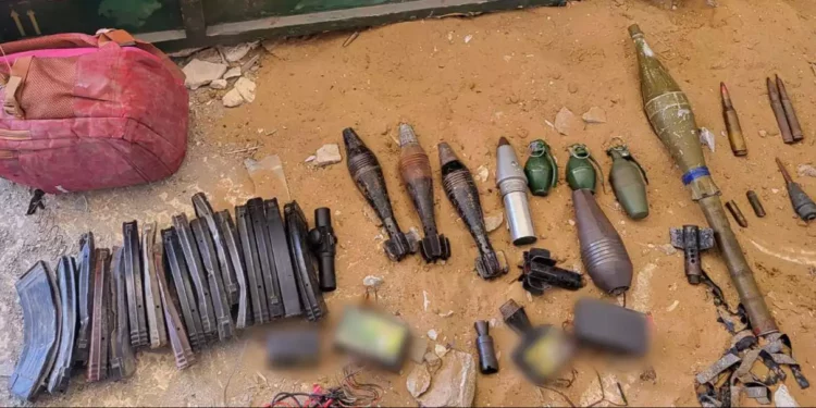 An arms cache uncovered by troops in Gaza, in a handout photo published by the Israeli military on May 30, 2024. (Israel Defense Forces)