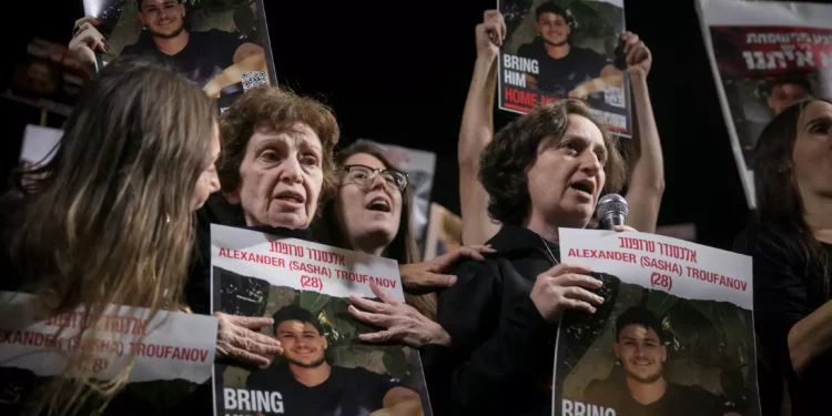 Freed hostages Yelena Trufanov, right, speaks next to her mother Irena Tati at a rally calling for the release of Israelis held hostage by Hamás terrorists in Gaza, in Hostage Square in Tel Aviv, December 2, 2023. (Miriam Alster/Flash90)