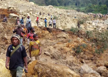 Locals gather at the site of a landslide at Mulitaka village in the region of Maip Mulitaka, in Papua New Guinea's Enga Province on May 26, 2024. (AFP)