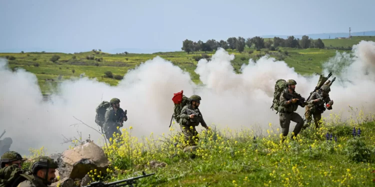 Israeli reserve soldiers train with their unit in urban warfare in northern Golan Heights, on March 27, 2024. (Michael Giladi/Flash90)