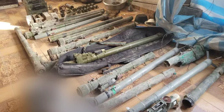 A cache of weapons found by troops in a school in northern Gaza's Jabaliya, in an image published May 26, 2024. (Israel Defense Forces)