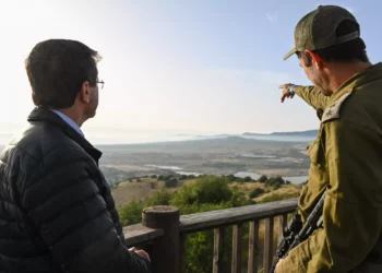 President Isaac Herzog, left, meets FDI officers in the evacuated town of Metula, near the Lebanon border, on May 28, 2024. (Maayan Toaf/GPO)