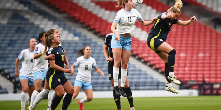 Israel's forward #13 Talia Sommer (C-L) jumps for the ball as she fights for it with Scotland's defender #05 Sophie Howard (R) during the UEFA Women's Euro 2025 League B Group 2 qualifying football match between Scotland and Israel at Hampden Park stadium in Glasgow, Scotland, on May 31, 2024. (Andy Buchanan/AFP)