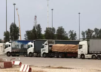 Trucks carrying humanitarian aid are pictured at the Israeli side of the Kerem Shalom border crossing with the Gaza Strip in southern Israel on May 28, 2024, amid the ongoing conflict in the Palestinian territory between Israel and Hamás. (Menahem Kahana/AFP)