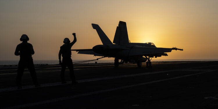 A fighter jet lands on the USS Dwight D. Eisenhower, also known as “IKE”, in the Red Sea on Tuesday, June 11, 2024. (AP Photo/Bernat Armangue)