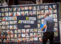 Fotografías de rehenes llevados a Gaza el 7 de octubre de 2023, en la Plaza de los Rehenes de Tel Aviv, el 19 de mayo de 2025. (Miriam Alster/Flash90)