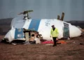 A policeman walking away from the damaged cockpit of the 747 Pan Am airliner that exploded and crashed over Lockerbie, Scotland, with 259 people on board, December 22, 1988. (ROY LETKEY/AFP)