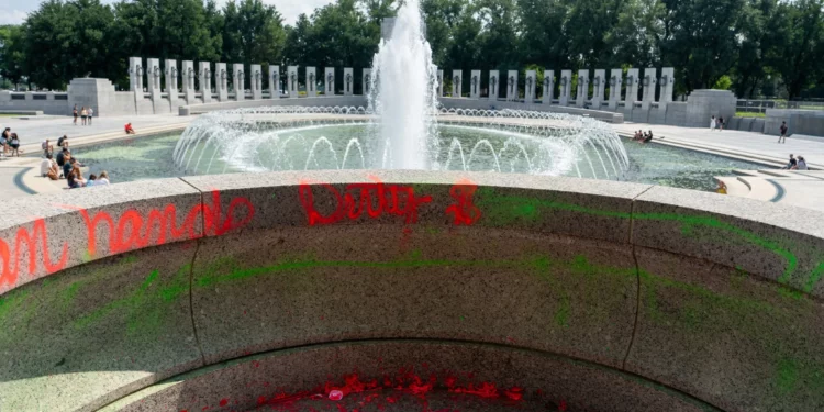 Damage seen after vandals poured bubble soap and painted graffiti on the World War II Memorial in Washington, DC on August 13, 2026. (Andrew Leyden/ZUMA Press Wire)