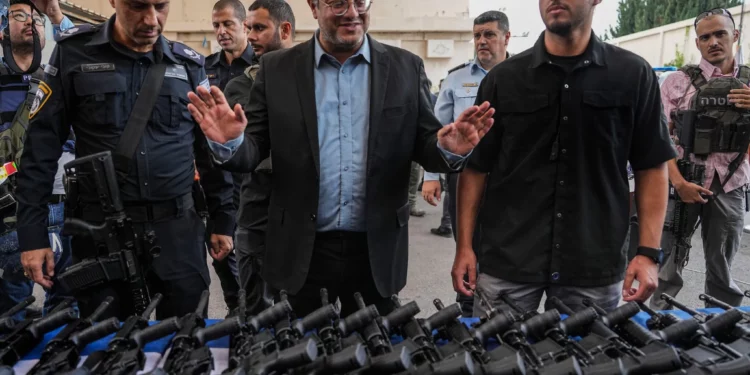 National Security Minister Itamar Ben-Gvir attends an event to deliver weapons to local volunteer security group members in Ashkelon, October 27, 2023. (AP/Tsafrir Abayov)