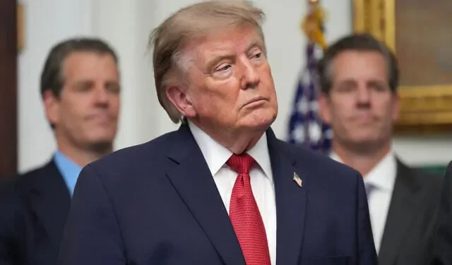 US President Donald Trump listens as Gemini co-founder and president Cameron Winklevoss, left, and Gemini co-founder and CEO Tyler Winklevoss, right, watch, during a meeting with technology leaders in the Roosevelt Room of the White House, August 19, 2026, in Washington. (AP Photo/Jacquelyn Martin)