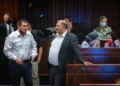 Yoav Segalovitz (left), at the time deputy public security minister, and Ra'am leader Mansour Abbas during a plenum session in the Knéset on December 6, 2021. (Olivier Fitoussi/FLASH90)