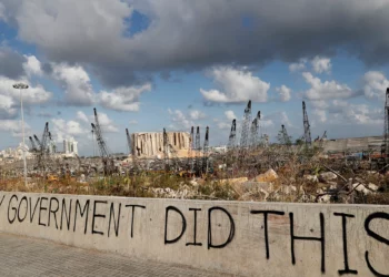 Words are written by Lebanese citizens in front of the scene of an explosion that hit the seaport of Beirut, Lebanon, August 9, 2020. (AP Photo/Hussein Malla)