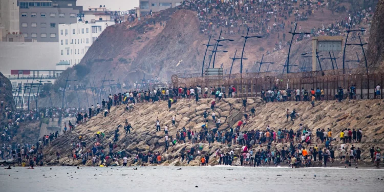 Migrants return to Morocco from the Spanish enclave of Ceuta, July 31, 2026. (AP Photo/Antonio Sempere)