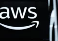 The logo of Amazon Web Services (AWS) is seen during the opening of the Hannover Messe industrial trade fair for mechanical and electrical engineering and digital industries, on March 31, 2025 in Hanover, northern Germany. (Photo by RONNY HARTMANN / AFP)