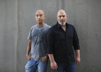 'Fauda' co-creators Avi Issacharoff (left) and Lior Raz in Tel Aviv, May 30, 2019. (AP Photo/Oded Balilty)