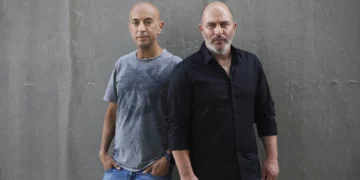 'Fauda' co-creators Avi Issacharoff (left) and Lior Raz in Tel Aviv, May 30, 2019. (AP Photo/Oded Balilty)