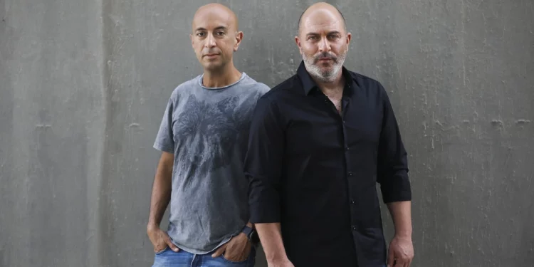 'Fauda' co-creators Avi Issacharoff (left) and Lior Raz in Tel Aviv, May 30, 2019. (AP Photo/Oded Balilty)