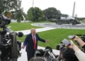 US President Donald Trump talks with reporters on the South Lawn of the White House before boarding Marine One, September 26, 2026, in Washington. (AP Photo/Rod Lamkey, Jr.)