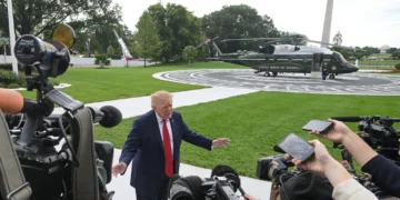 US President Donald Trump talks with reporters on the South Lawn of the White House before boarding Marine One, September 26, 2026, in Washington. (AP Photo/Rod Lamkey, Jr.)