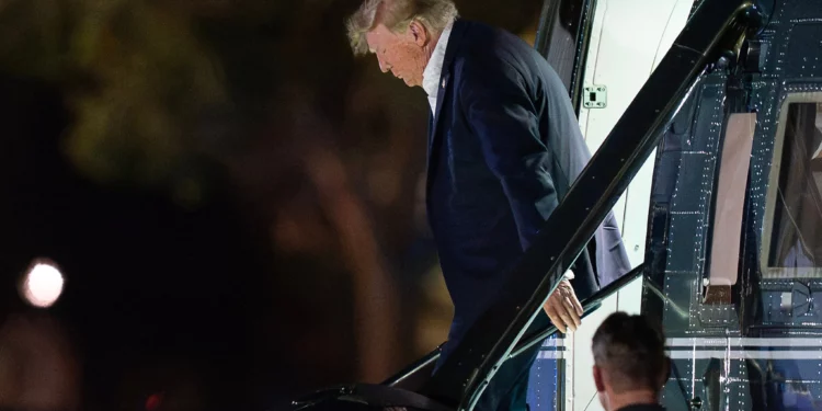 President Donald Trump steps off from Marine One upon his arrival at the Ellipse just outside of the White House, September 13, 2026, in Washington. (AP Photo/Jose Luis Magana)