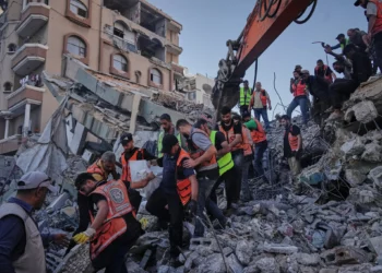 Palestinian civil defense crews carry a body from the rubble of a collapsed building that housed displaced Palestinians and was heavily damaged during the Israel-Hamas war, in Gaza City, September 16, 2026. (AP/Jehad Alshrafi)