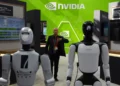 A worker stands near robots at the Nvidia booth during the China International Supply Chain Expo in Beijing on June 22, 2026. (Ng Han Guan/AP)