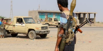 Forces loyal to Yemen’s Saudi-backed government stand near a pickup truck in the Hays district, south of Hodeidah, September 5, 2026. (Khaled ZIAD/AFP)