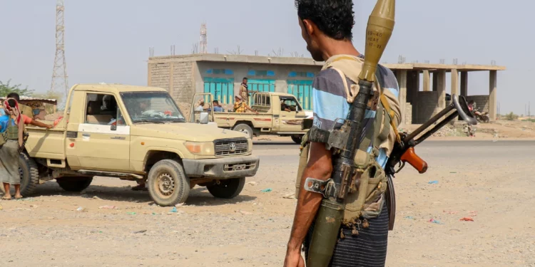 Forces loyal to Yemen’s Saudi-backed government stand near a pickup truck in the Hays district, south of Hodeidah, September 5, 2026. (Khaled ZIAD/AFP)