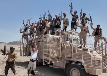 This image taken from undated video released by the Houthi-run Al-Masirah television channel on September 12, 2026, shows Houthi fighters chanting and raising rifles atop a military vehicle in Dhubab district, Taiz province, Yemen, according to the channel. (Al-Masirah TV via AP)