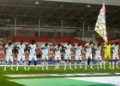 Ireland's soccer players bow their heads as the Israeli national anthem plays before their UEFA Nations League match in Debrecen, Hungary, September 27, 2026. (Bernadett Szabo/Reuters)