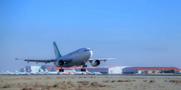 Illustrative: an Iranian Mahan Air plane lands at the Tehran's Imam Khomeini International Airport, February 4, 2021. (Saeed Kaari/IKAC via AP)