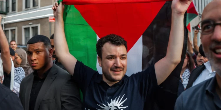 Anti-Israel, pro-Palestinian US activist Mahmoud Khalil carries a Palestinian flag during a rally celebrating his return from immigration detention, June 22, 2025, in New York. (AP Photo/Olga Fedorova)