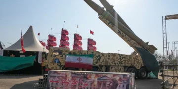 Iranian missiles are displayed by the armed forces as an anti-Trump banner declaring in English and Farsi, 'We will kill you,' is seen in a temporary exhibition at Azadi (Freedom) Square in Tehran, Iran, July 29, 2026. (AP Photo/Vahid Salemi)