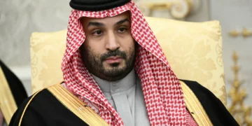 Crown Prince of Saudi Arabia Mohammed bin Salman looks on during a meeting with US President Donald Trump (not pictured) in the Oval Office of the White House in Washington, DC on November 18, 2025. (Brendan SMIALOWSKI / AFP)