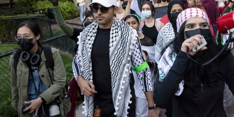 Mohsen Mahdawi, center, looks on during a pro-Palestinian protest at Columbia University, October 12, 2023, in New York. (AP/Yuki Iwamura, File)