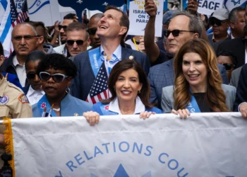 New York Governor Kathy Hochul, center, and New York City Speaker Julie Menin, right, at the Israel Day on Fifth parade in New York City, May 31, 2026. (Luke Tress/Times of Israel)