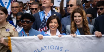 New York Governor Kathy Hochul, center, and New York City Speaker Julie Menin, right, at the Israel Day on Fifth parade in New York City, May 31, 2026. (Luke Tress/Times of Israel)