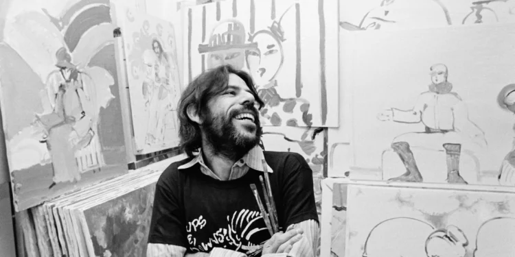 Peter Max posa entre varias de sus obras en su estudio de Nueva York el 11 de noviembre de 1973.