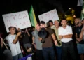 Right-wing activists protest against filmmaker Rachel Szor and her film 'NAZA' outside her parents’ home in Savyon, central Israel, September 16, 2026. (Erik Marmor/Flash90)