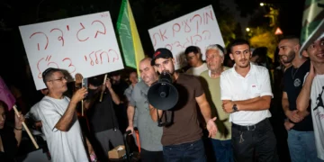 Right-wing activists protest against filmmaker Rachel Szor and her film 'NAZA' outside her parents’ home in Savyon, central Israel, September 16, 2026. (Erik Marmor/Flash90)