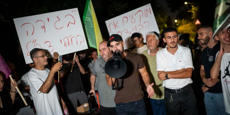Right-wing activists protest against filmmaker Rachel Szor and her film 'NAZA' outside her parents’ home in Savyon, central Israel, September 16, 2026. (Erik Marmor/Flash90)