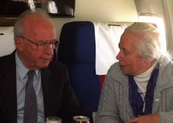 Prime Minister Yitzhak Rabin with his sister, Rachel, aboard a flight to Oslo in 1994. (GPO/Yaakov Saar)